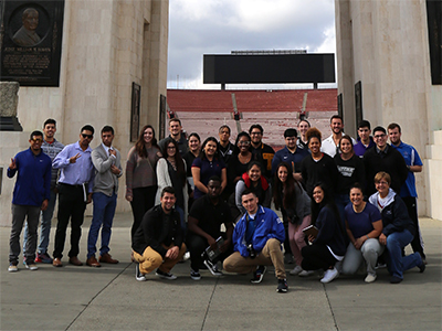 A kinesiology class and Professor Kathy Barlow pose for a group photo at L.A. Coliseum.