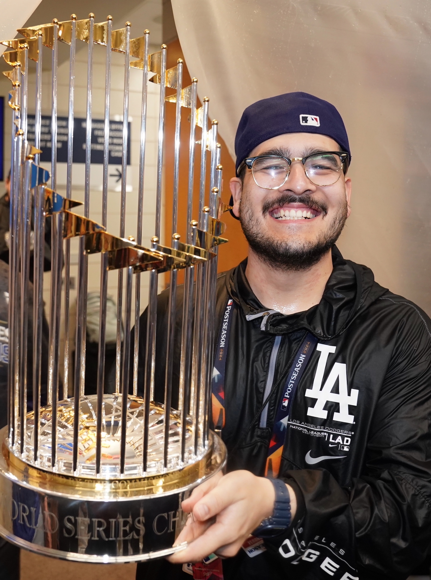 Alex Perez ’17 holds The Commissioner's Trophy after the Dodgers win the 2024 World Series. | Courtesy Alex Perez ’17