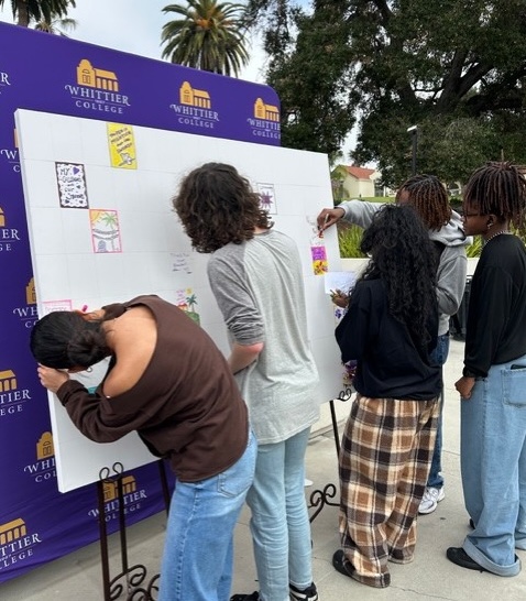 Students signing Big Poet Give wall