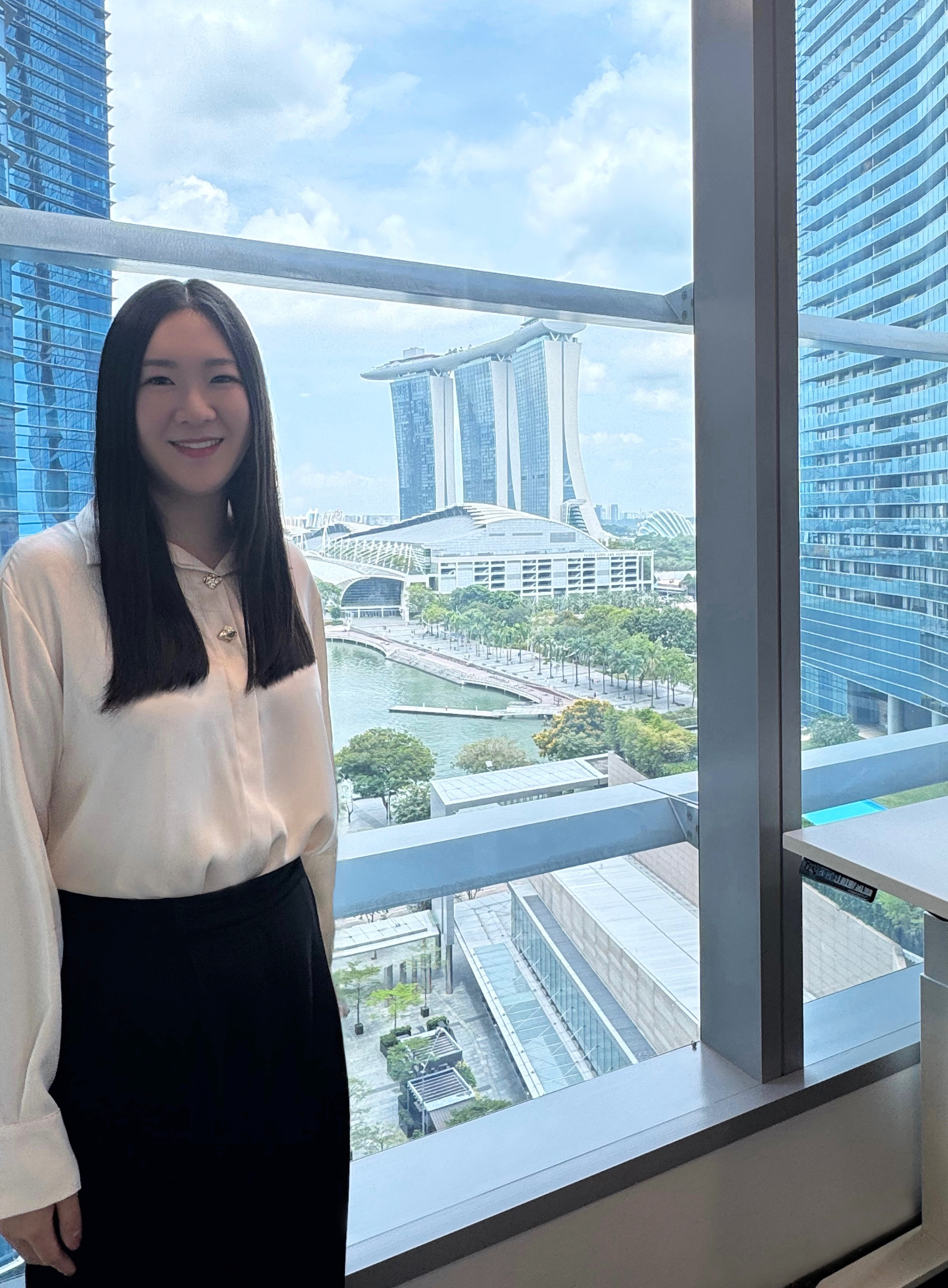 Joey Zou ’16 at her office in Singapore. | Courtesy Joey Zou ’16