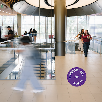Students walking on campus in a blur