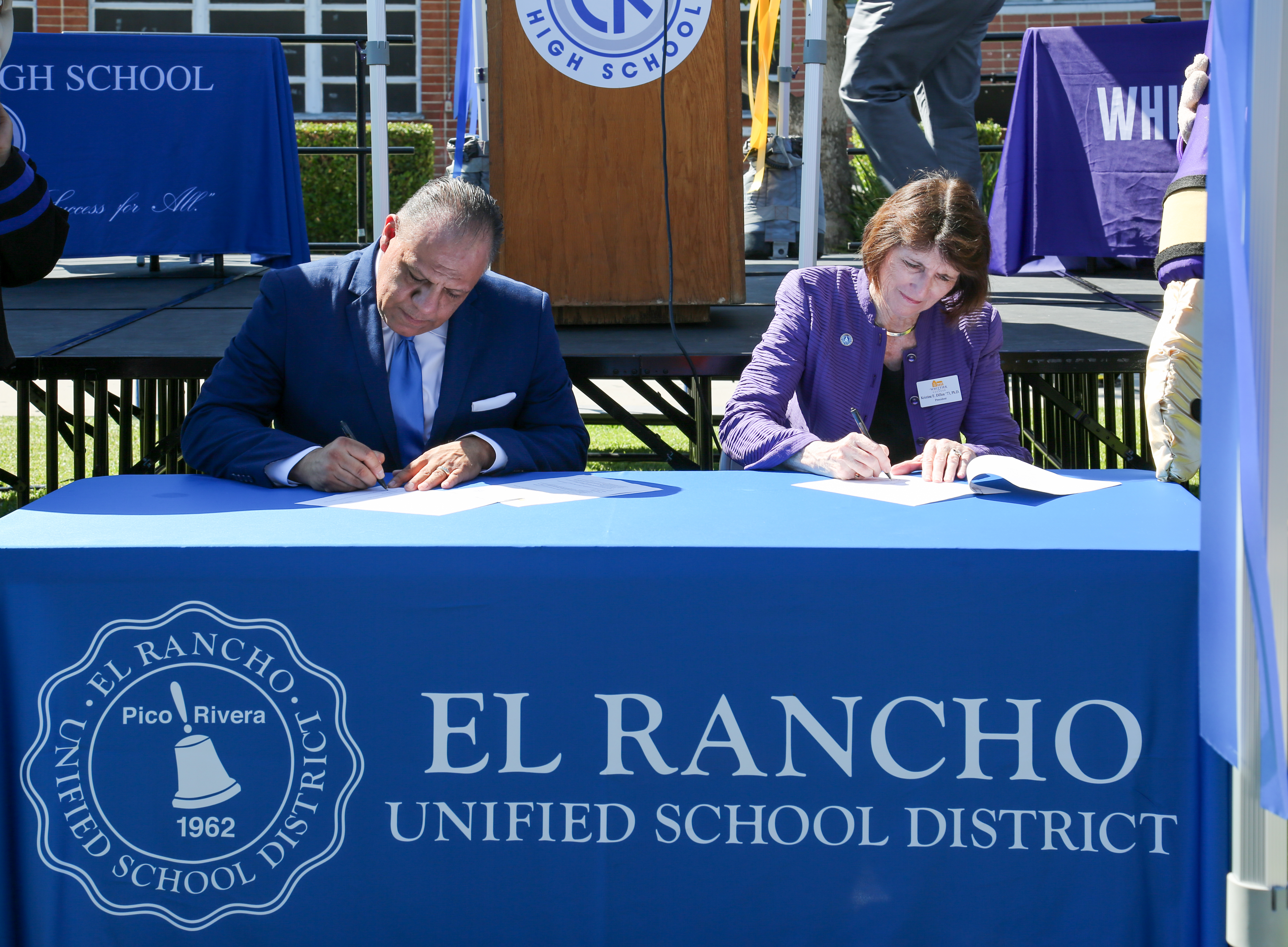 President Kristine Dillon '73, right, signs an agreement with El Rancho High School to support students and guarantee admission. | Whittier College