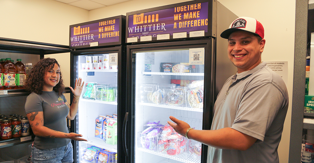 Two students in front of refridgerator