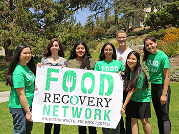 Food Recovery members with a sign