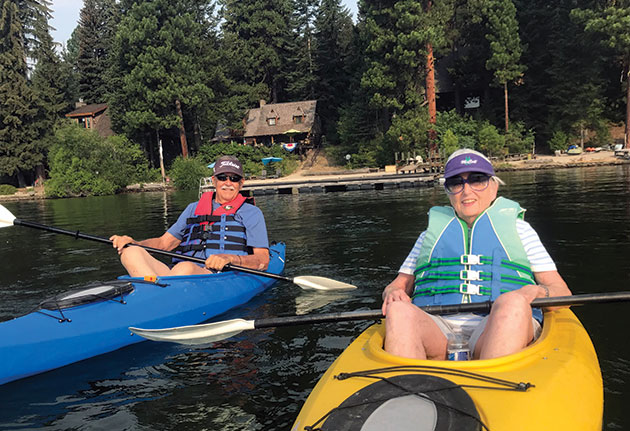 Craig and Susan (Perry) Elliott sitting in kayaks.