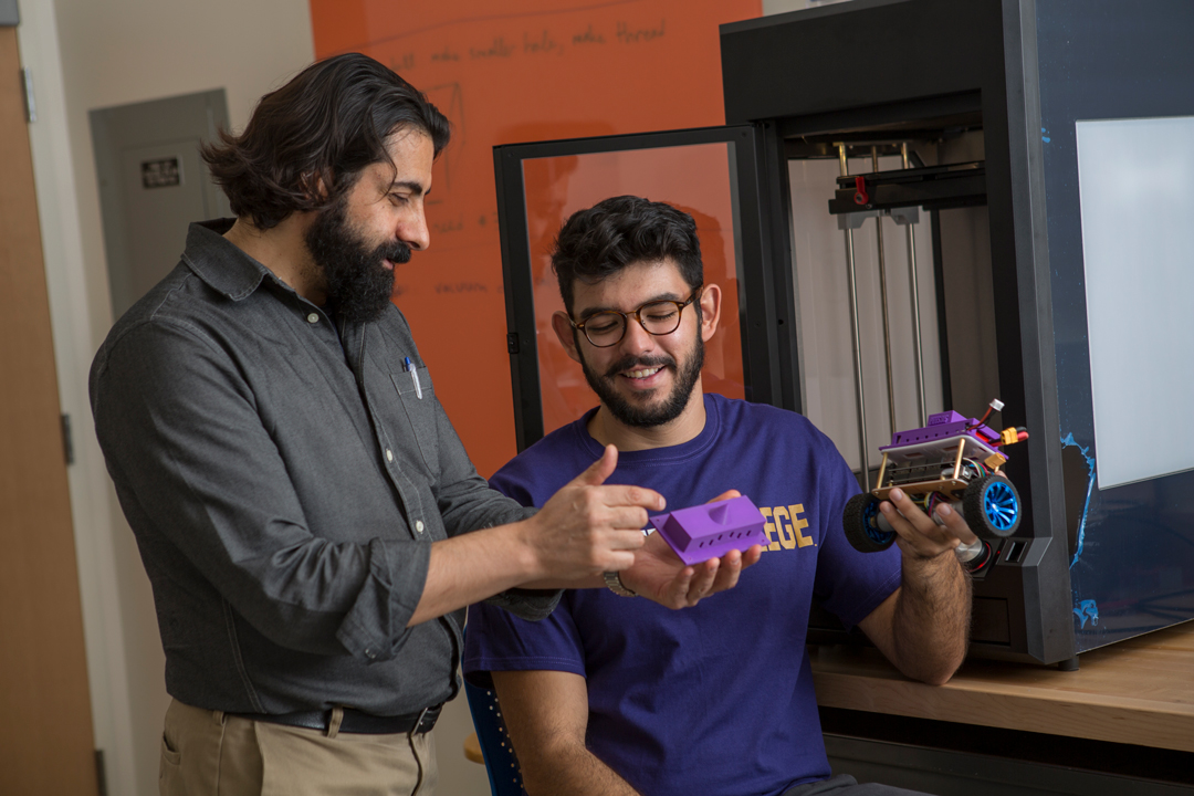 Professor and student using 3D printer