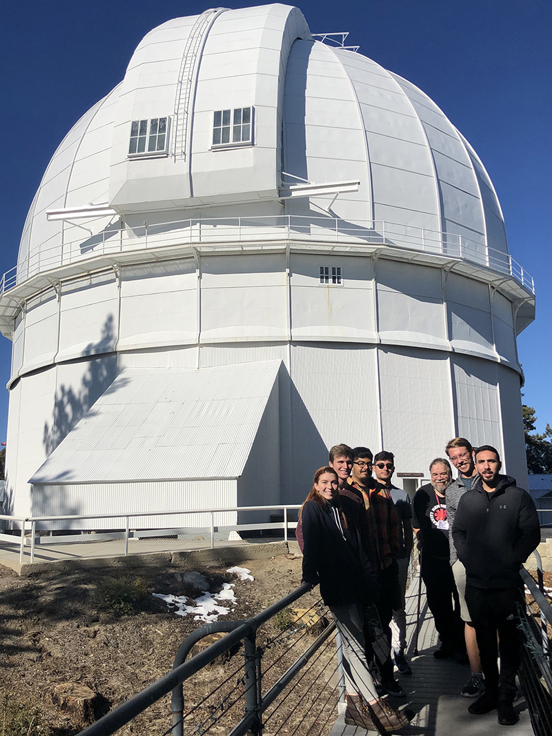 Students and a tour guide in front of Mount Wilson Observatory
