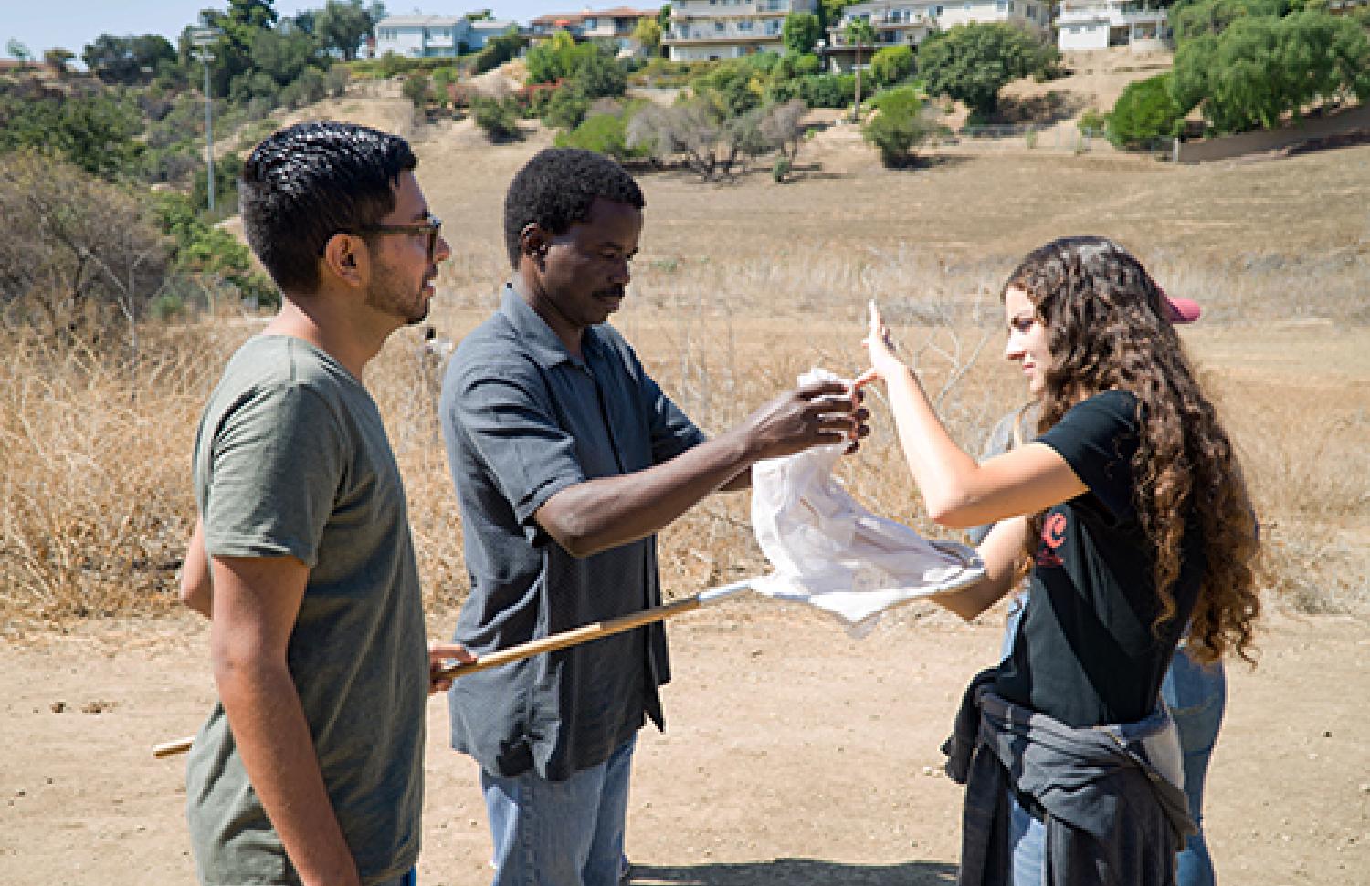 Students and professor with a net