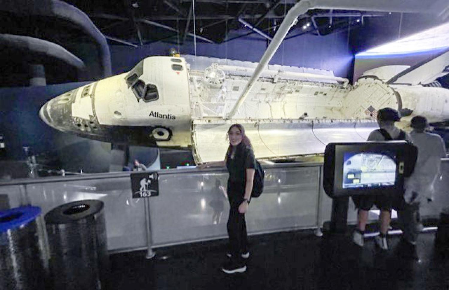 Natasha in front of space shuttle