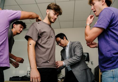 Students and professor in a lab