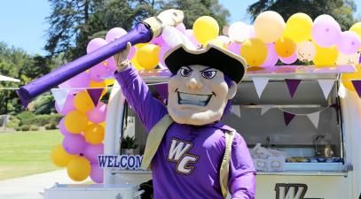 Johnny Poet stands at the Poet MoWheel on the first day of class, Aug. 21, 2024 | Whittier College