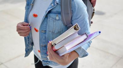 Student holding textbooks