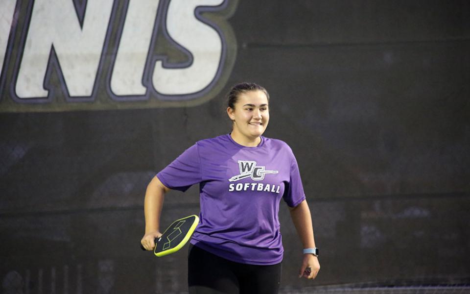 Student playing pickleball