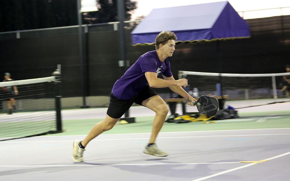 Student playing pickleball